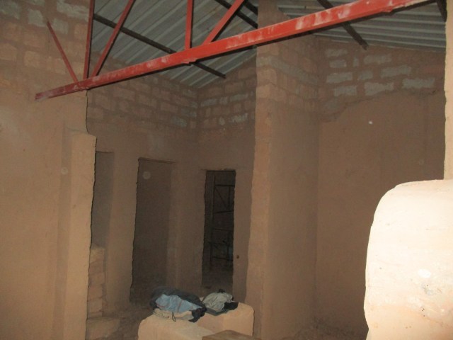 Raised roof and unfinished portion of the wall