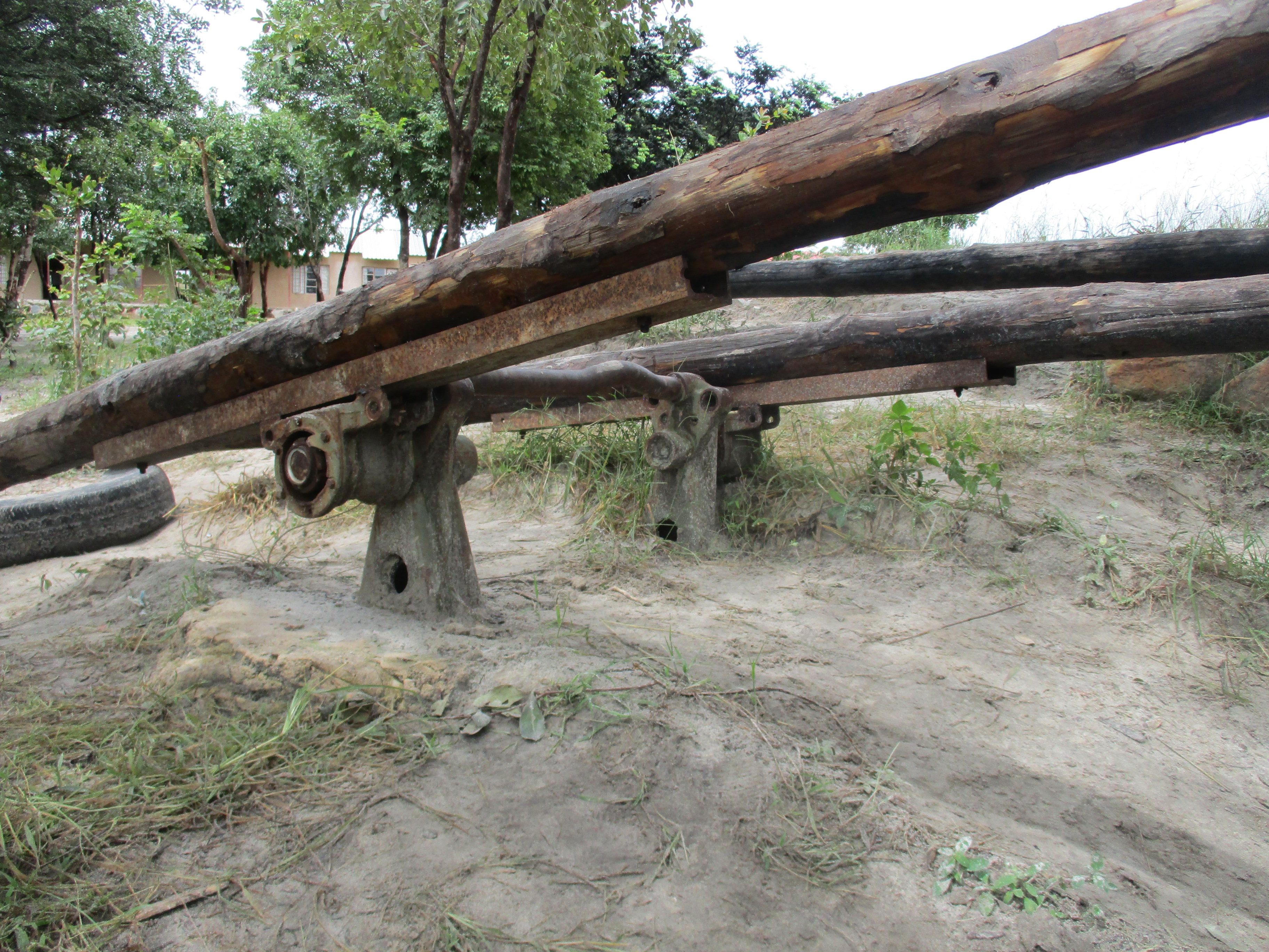 Playground teeter totter made from a truck axle