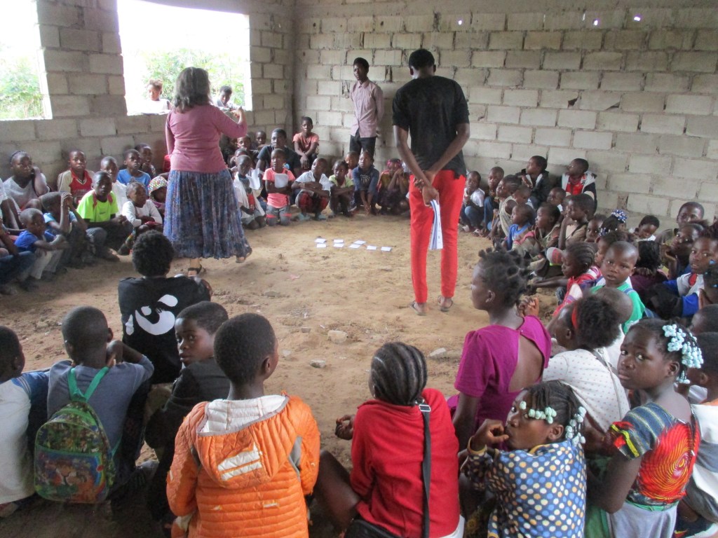 Joan and Jose (in black and red) teaching students at his school