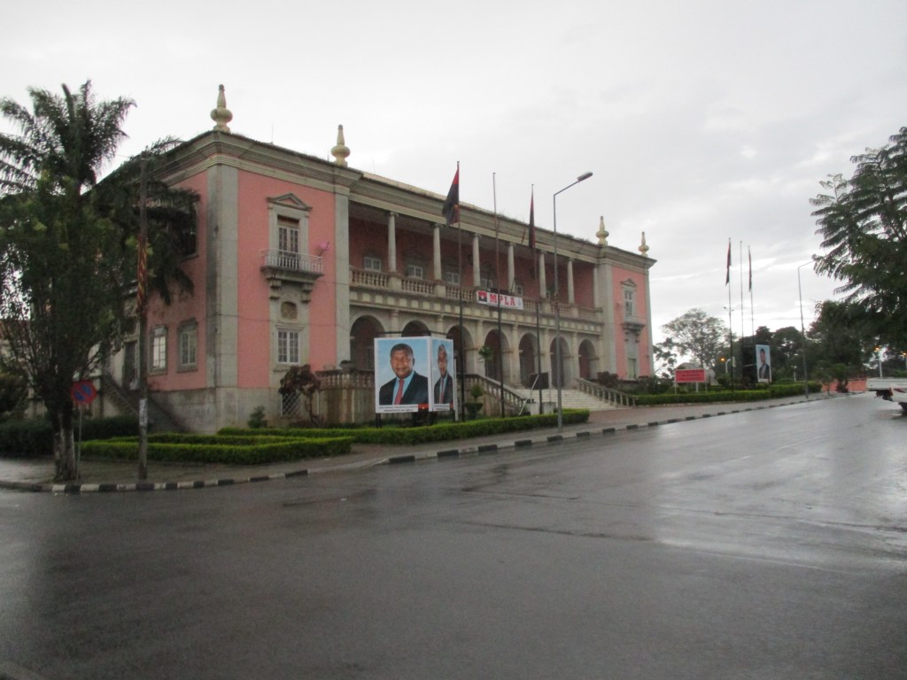 Government building in Huambo, Angola. President's face on posters out front