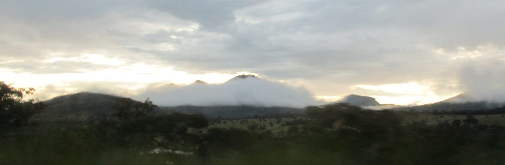 Mountain shrouded in early-morning fog in Angola