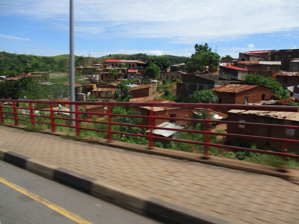 Village speeds by near the highway Luanda, Angola