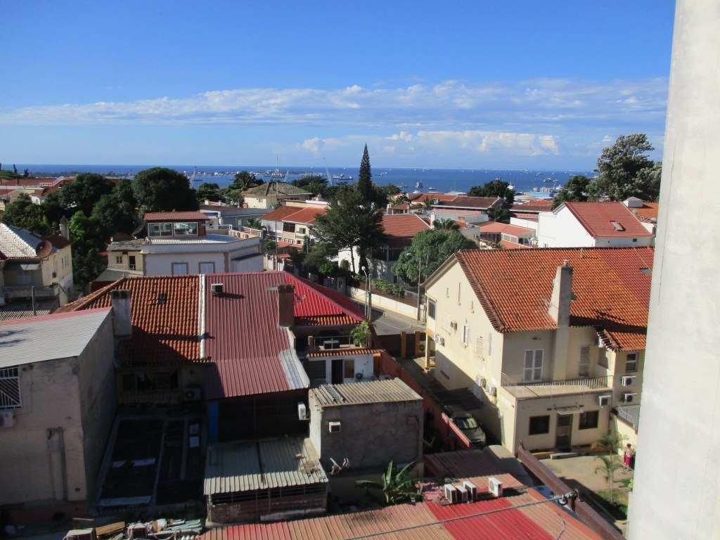 Rooftops in Luanda, Angola. Sky and sea in the distance