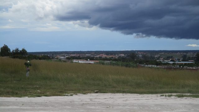 Gathering clouds over Menongue in the distance