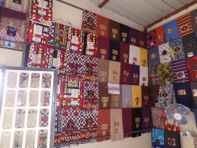 selection of cloth designs on a wall