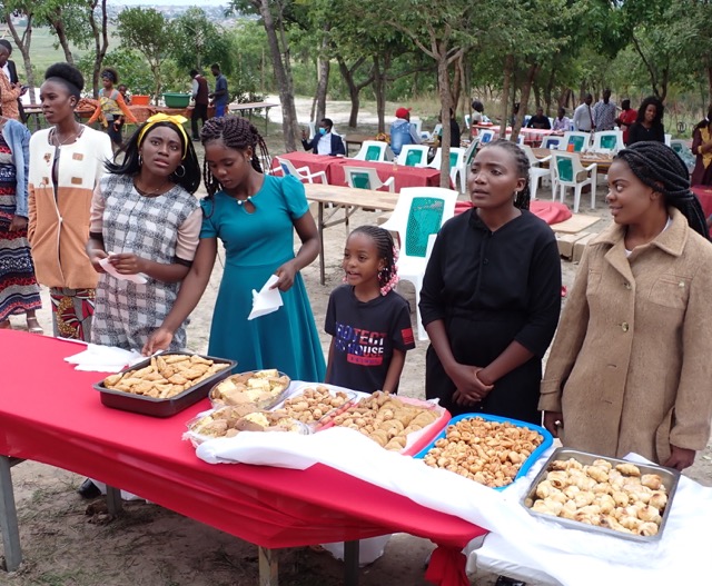 dessert table at an outdoor wedding reception in africa