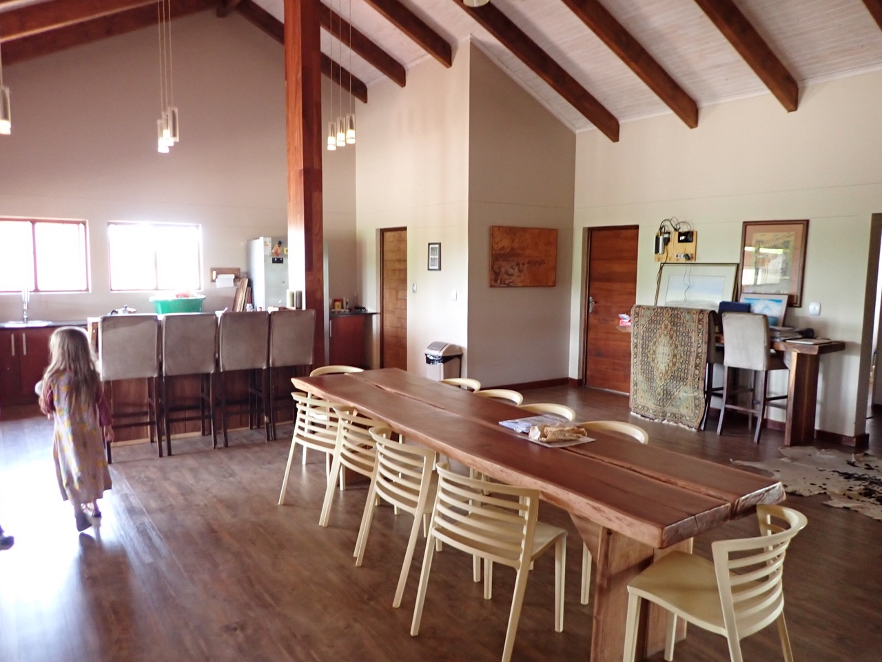girl in dining room of uncharted safaris lodge in menongue angola