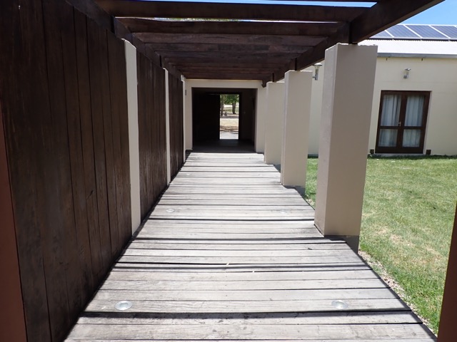 walkway of uncharted safaris lodge looking toward the outer entrance