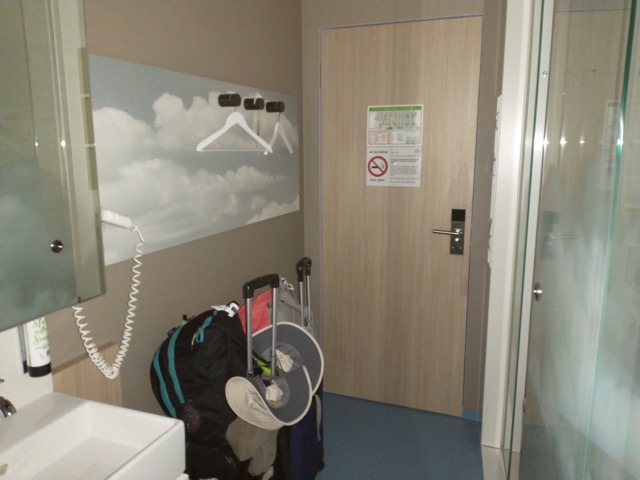 luggage in a transit hotel room