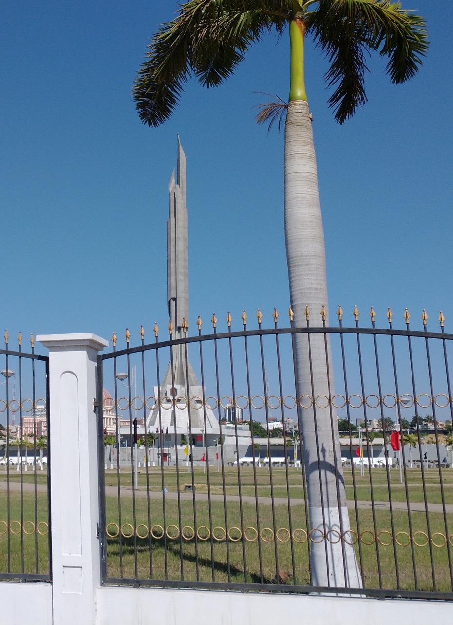 spiral monument memorial behind a fence