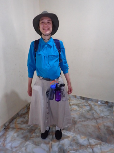 woman ready to travel with stuffed pockets and shirt