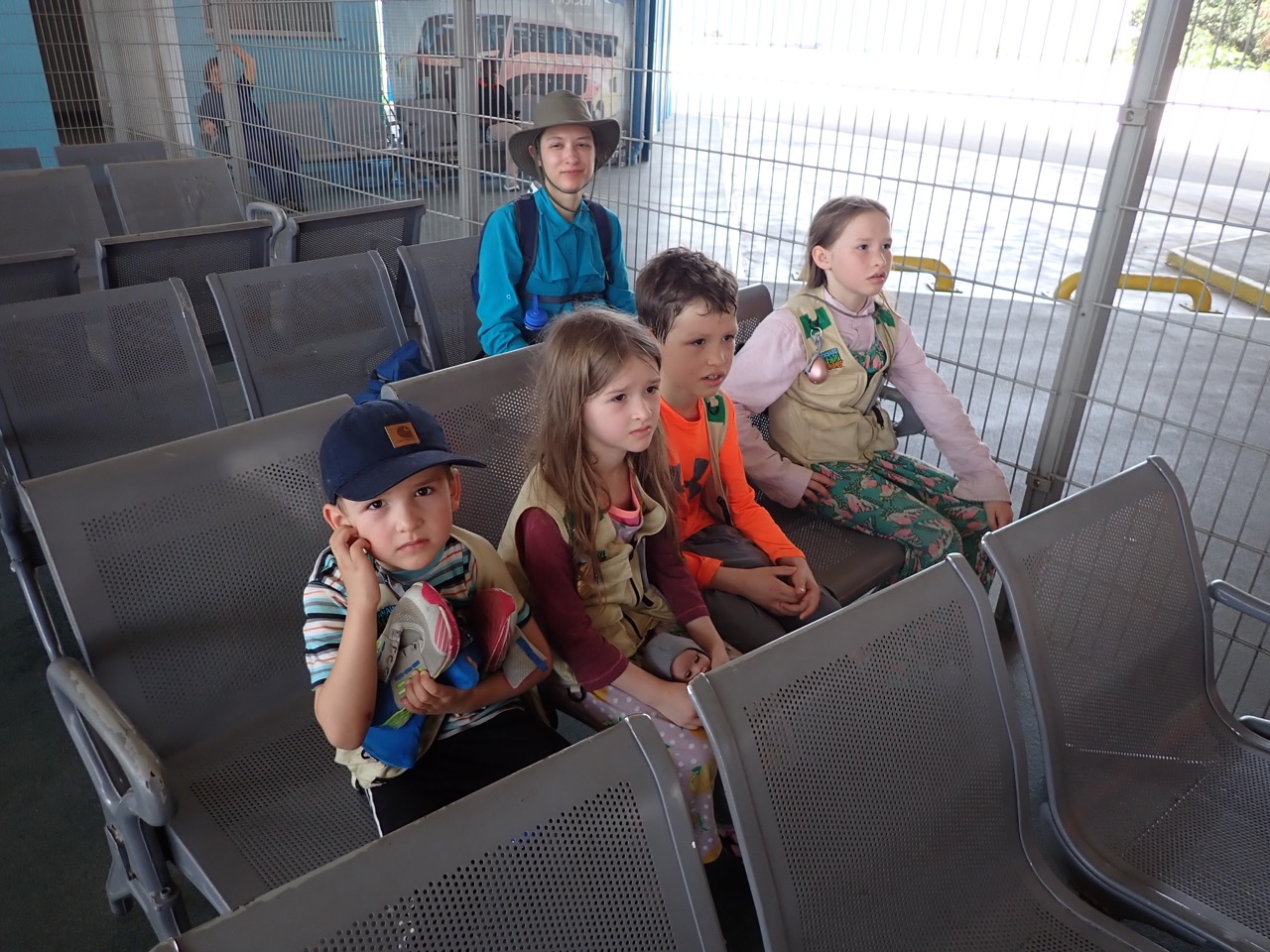 family waiting for a bus