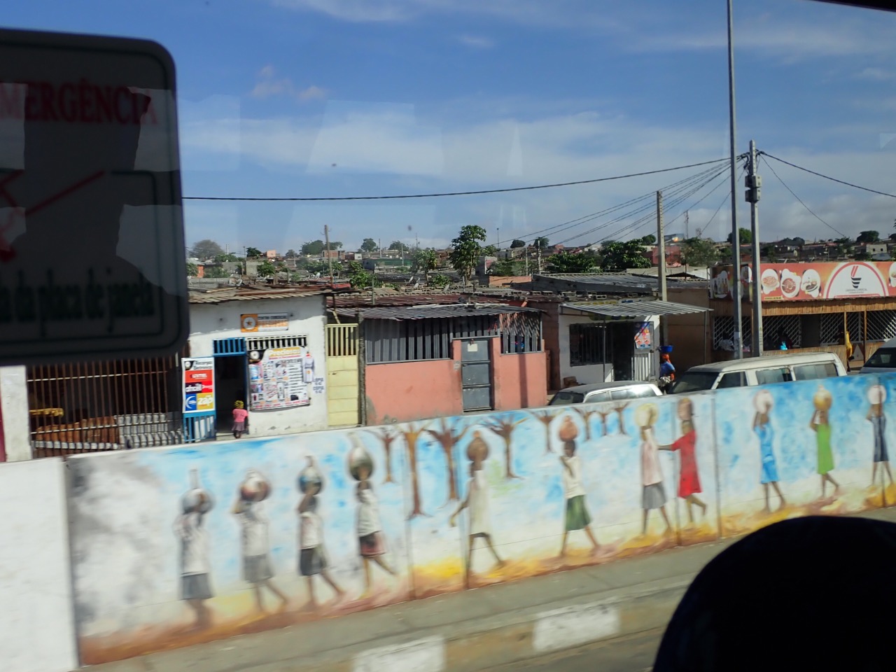 wall mural of people walking as seen from a bus in luanda angola africa
