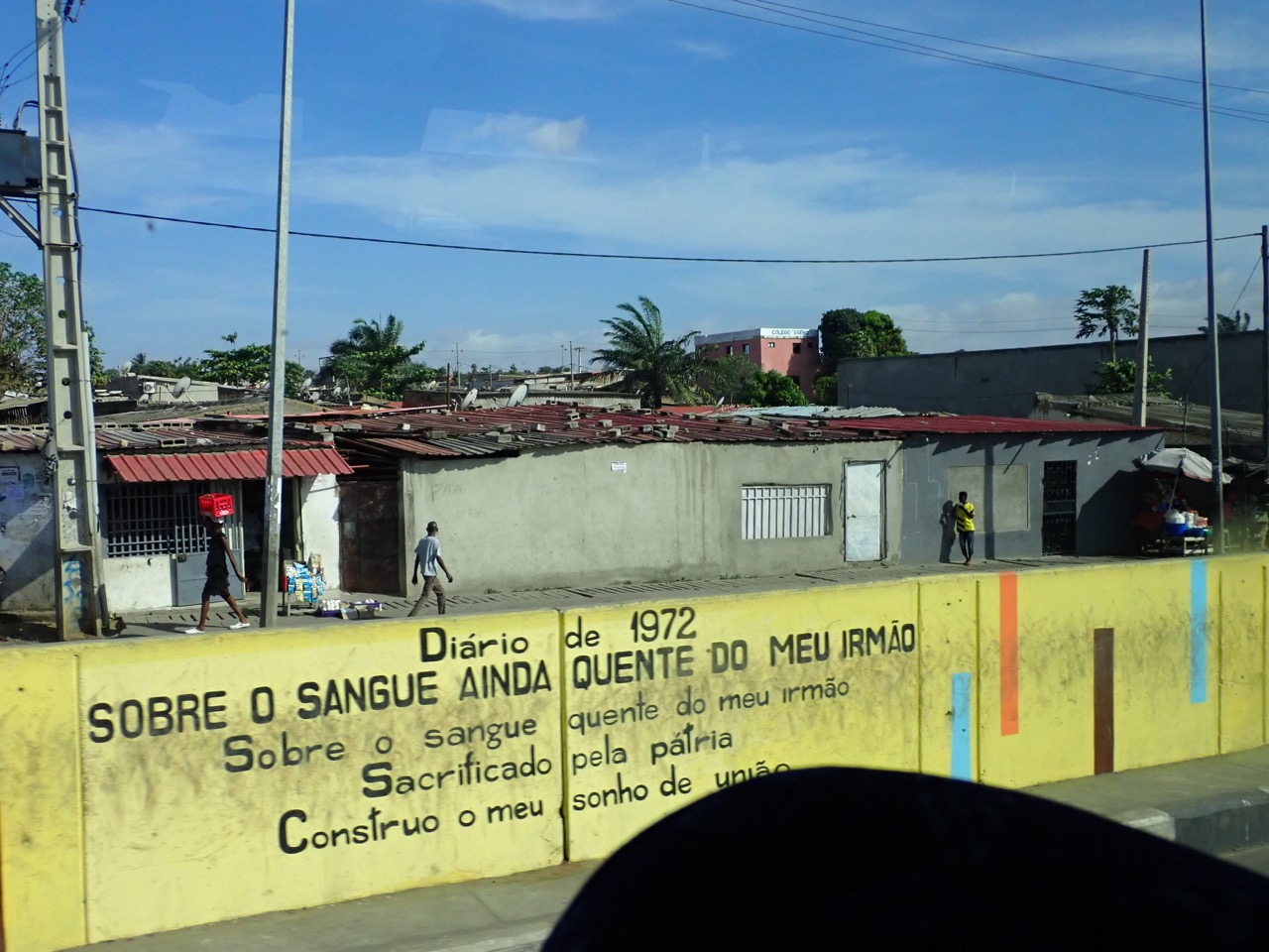 mural in portuguese in luanda saying, On the still warm blood of my brother sacrificed for the homeland I build my dream of unity