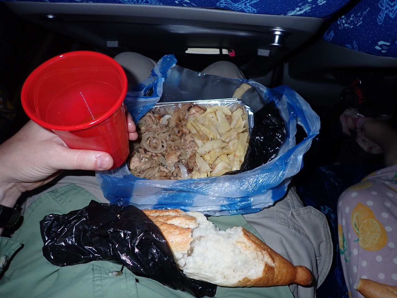 food and drink in lap of bus rider